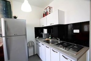 Standard Apartment, 1 Bedroom, City View | Private kitchen | Full-size fridge, microwave, stovetop, electric kettle - Arendalzrail Apartments -Rothschild St.8 (Bat Yam)