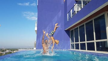 Outdoor pool, open 8:00 AM to 10:00 PM, pool loungers