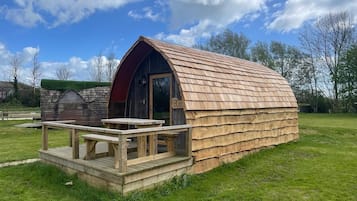 A wooden cabin with a porch and a door labeled "Blaac".