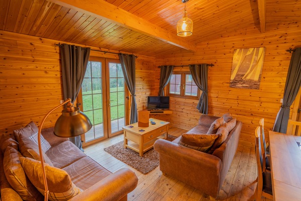 Kingfisher Log Cabin | Living area | Flat-screen TV