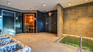 Relax in the spa area with a hot tub and comfortable seating.