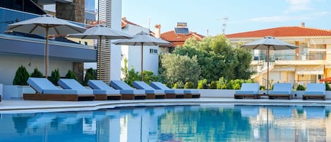 Seasonal outdoor pool, pool umbrellas, sun loungers