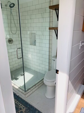 Shower, hair dryer, towels, toilet paper