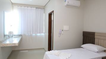 Basic Single Room | Blackout drapes, iron/ironing board, free WiFi, bed sheets