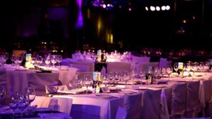 A banquet hall with tables set for a formal event, featuring white tablecloths and glassware. - EL MIRADOR HOTEL SPA (Colonia del Sacramento)