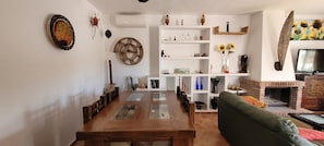 Smart TV, fireplace, books, offices