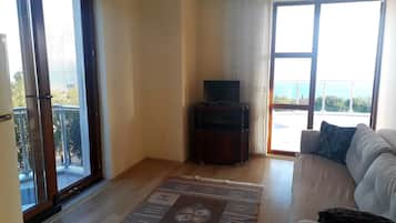 Standard Apartment, Sea View | Living area | 24-inch LCD TV with satellite channels