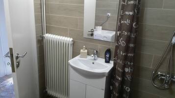 Combined shower/tub, hair dryer, towels, soap