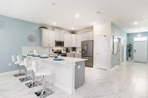 House | Private kitchen | Fridge, microwave, oven, stovetop - 9BR ChampionsGate Pool Home (Davenport)
