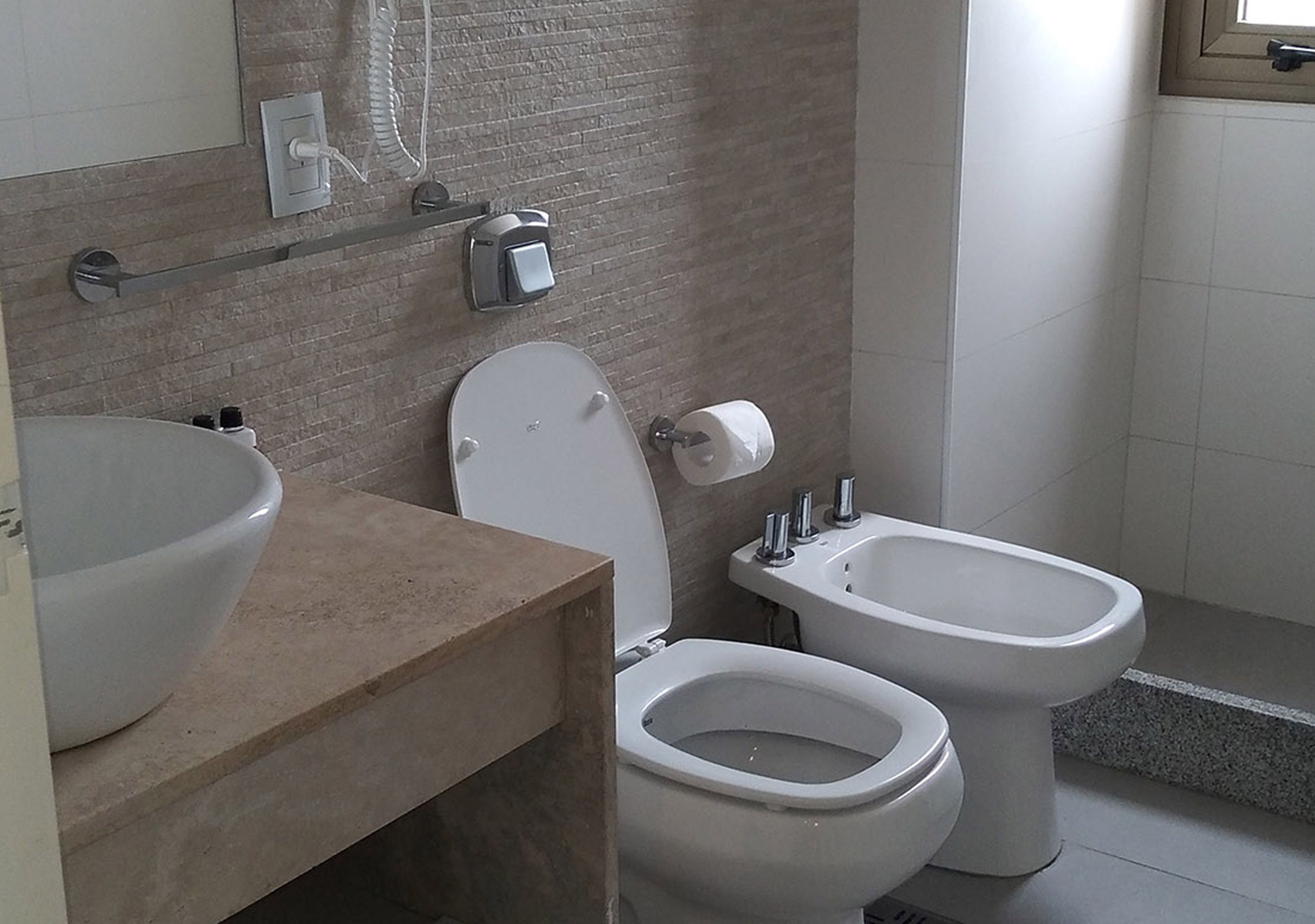 free toiletries, hair dryer, bidet, towels