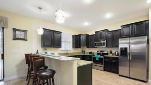 House | Private kitchen | Stovetop, dishwasher, cookware/dishes/utensils - 6BR 6BA Villa In ChampionsGate (Davenport)