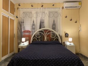 Family Apartment, City View | 3 bedrooms, in-room safe, individually decorated, iron/ironing board