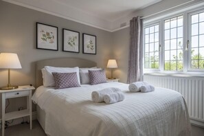 First floor: Bedroom two with king-size bed