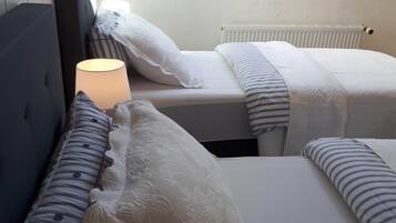 2 bedrooms, desk, iron/ironing board, cribs/infant beds