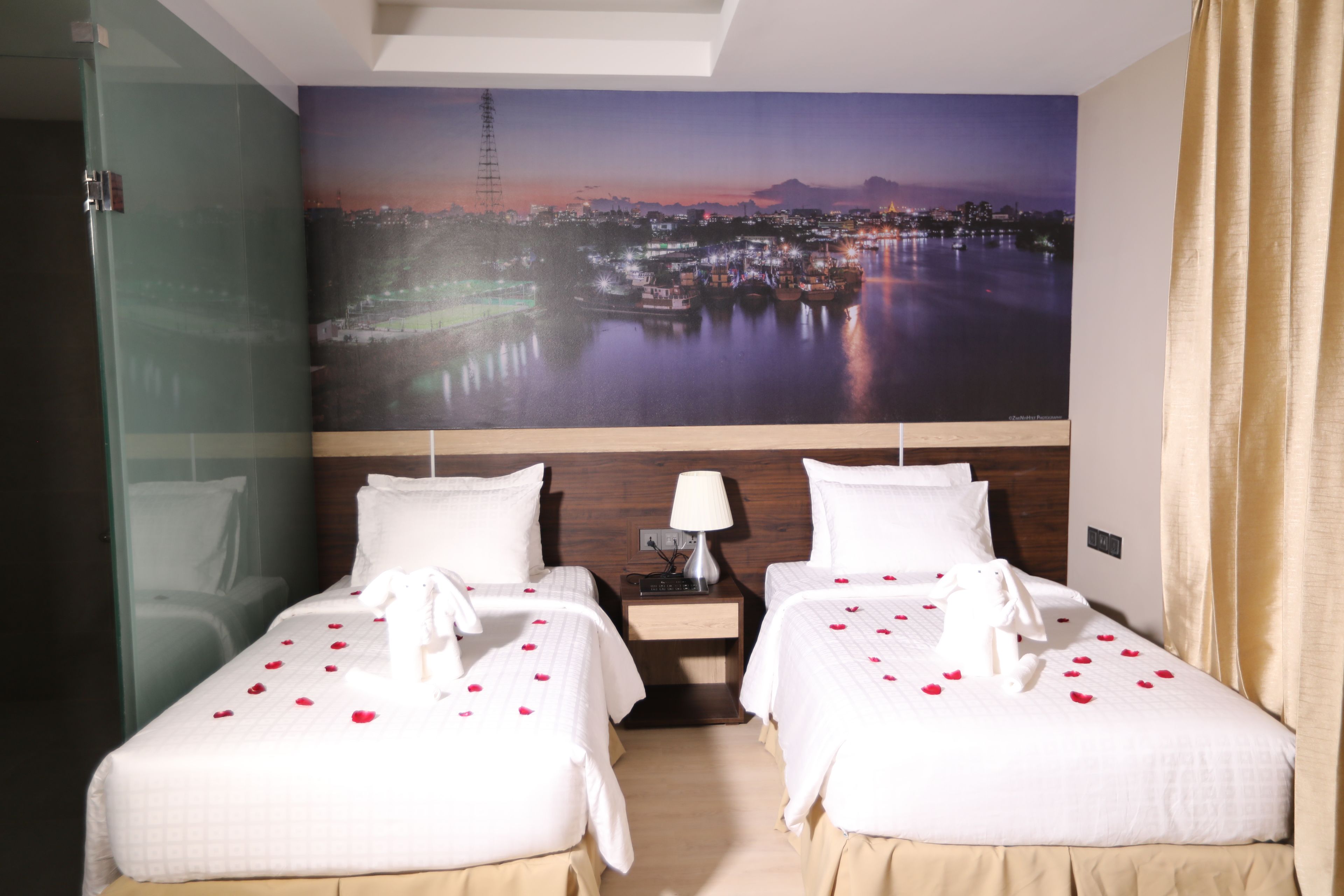 deluxe room, river view | minibar, in-room safe, desk, laptop workspace