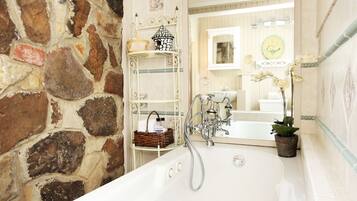 Jetted tub, hair dryer, towels, soap