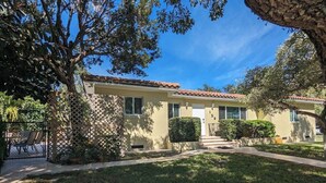 A residential building with a front yard, a patio, and a mailbox. - 3/2 Heated Private Pool, 5 Min to Beach (Lantana)