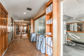 Guest rooms lead to a reception area with a counter and seating.
