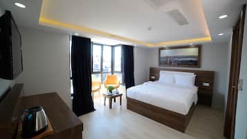Comfort Suite, 1 Queen Bed, City View | In-room safe, individually decorated, individually furnished