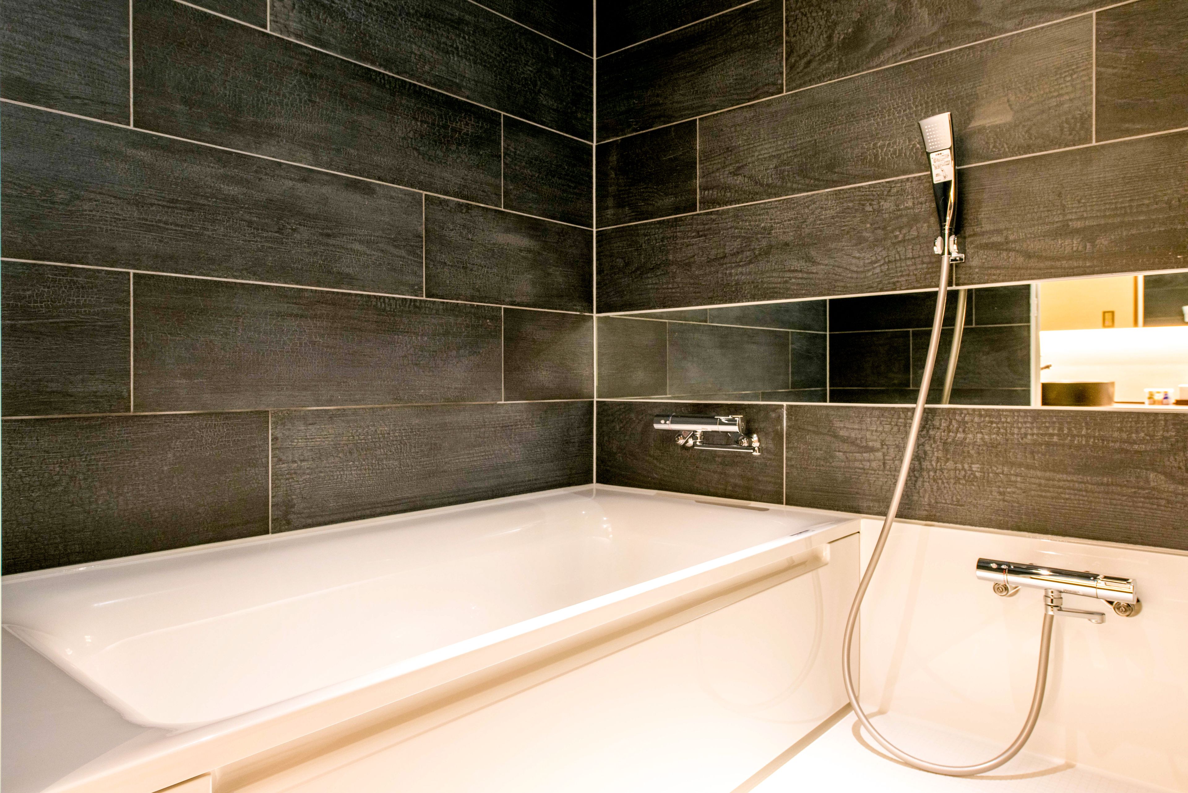 separate bathtub and shower, free toiletries, hair dryer, slippers