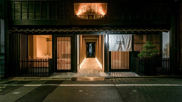 A traditional Japanese building with a wooden facade and a sign above the entrance. - Hotel ZIZI Kyoto Gion (Kyoto)
