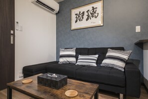 Shiki Homes | RURI | Living area | 55-inch flat-screen TV with digital channels - Shiki Homes RURI (Osaka)