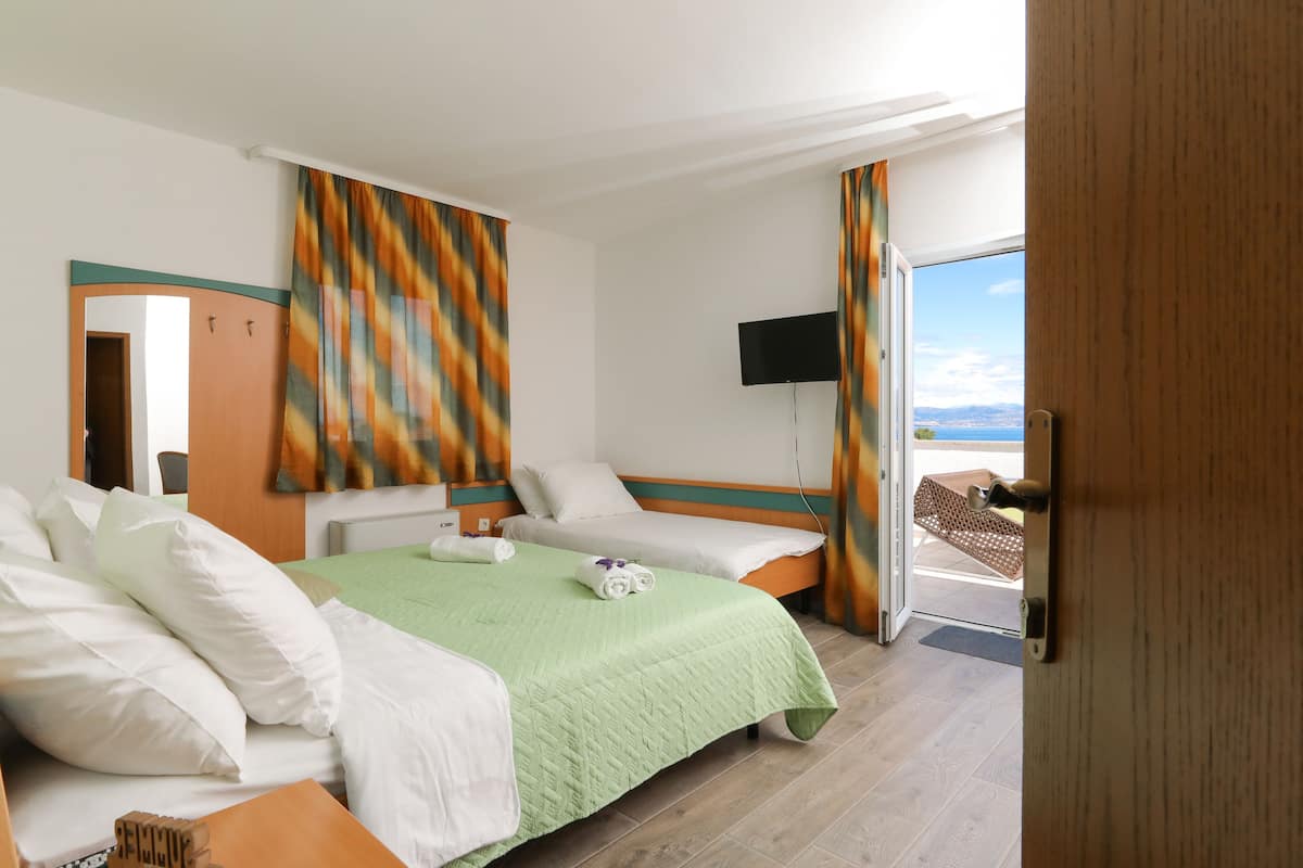 Basic Triple Room, Sea View | Desk, iron/ironing board, free WiFi