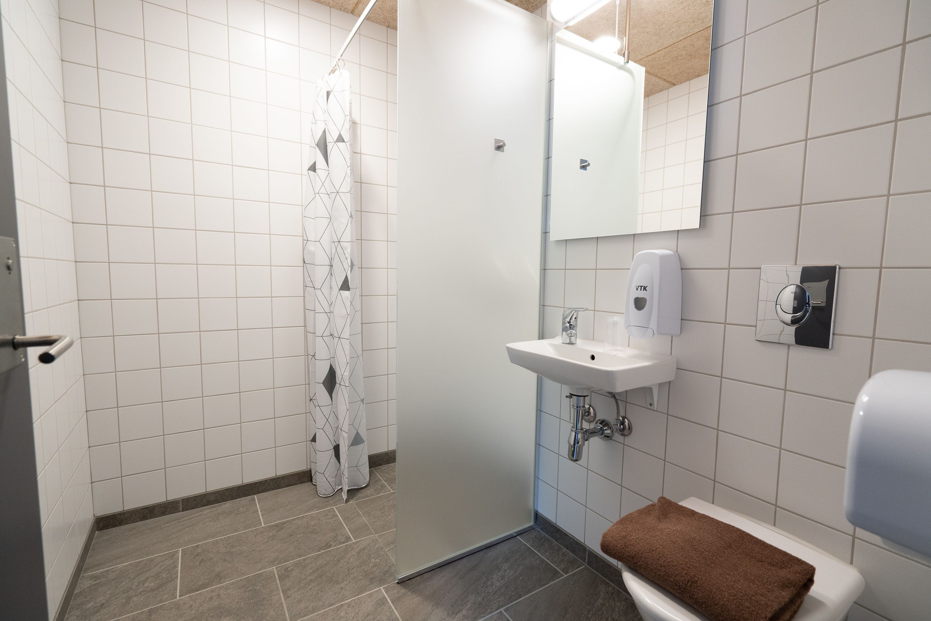 shower, hair dryer, soap, toilet paper