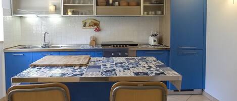 Fridge, oven, dining tables