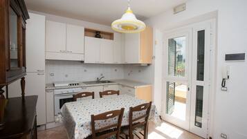 Fridge, oven, dining tables