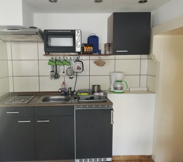 Fridge, microwave, stovetop, coffee/tea maker