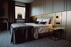 Habitación Deluxe | 1 dormitorio, caja fuerte, escritorio y sistema de insonorización