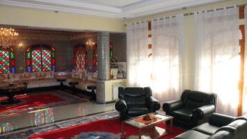 Deluxe Villa | Living area | Flat-screen TV