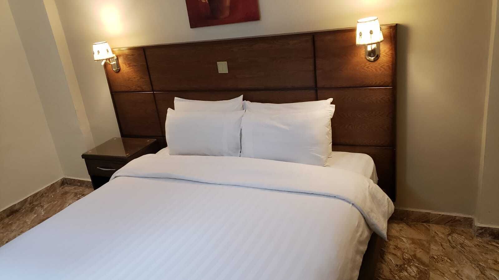 family quadruple room, multiple beds, city view | individually decorated, individually furnished, desk, blackout curtains