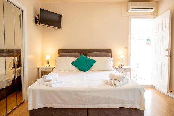 Apartment, 1 Bedroom | Iron/ironing board, cribs (free), WiFi (free), bed sheets