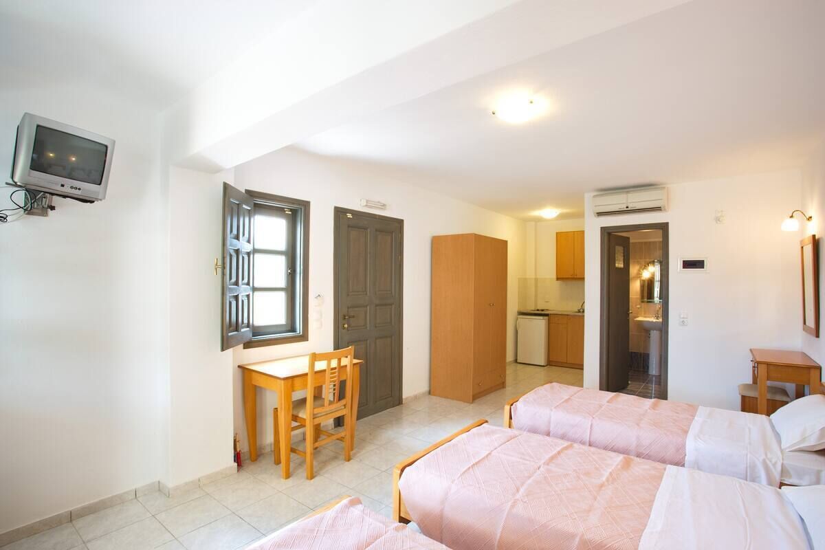 triple room with sea/garden view | in-room safe, iron/ironing board, free wifi, bed sheets