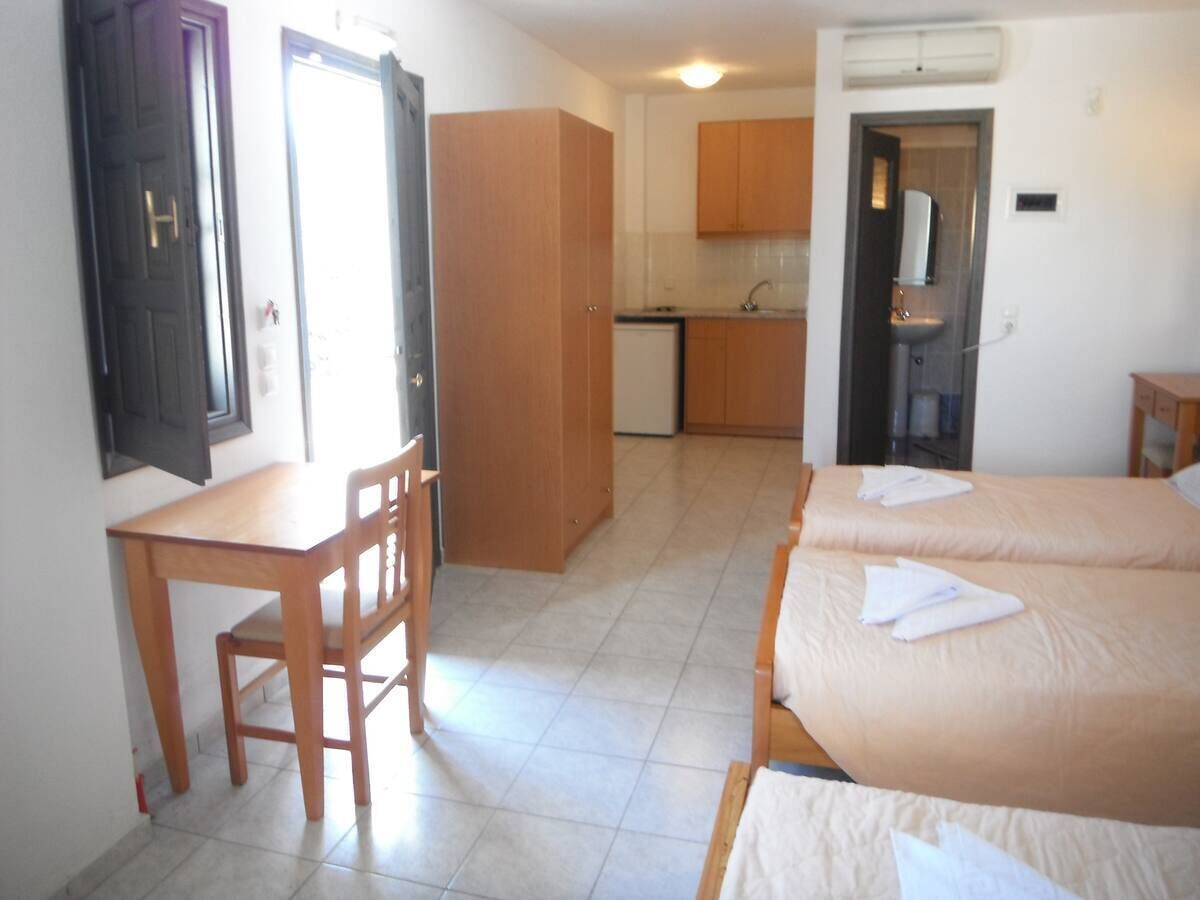 triple room with sea/garden view | in-room safe, iron/ironing board, free wifi, bed sheets