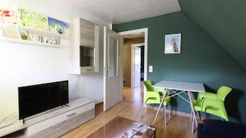 Panoramic Studio | Living area | Flat-screen TV