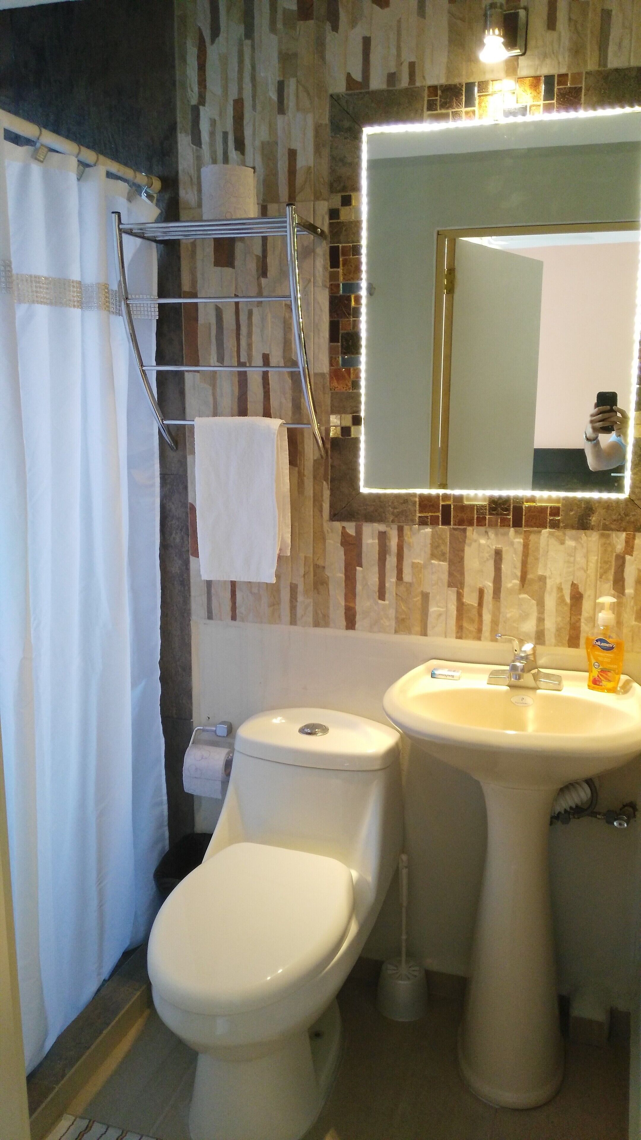 Shower, towels, soap, toilet paper