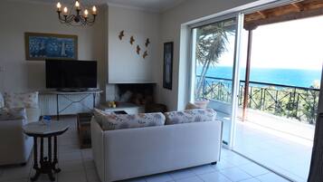Apartment, 3 Bedrooms | Living area | TV, fireplace