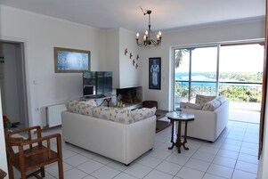 Apartment, 3 Bedrooms | Living area | TV, fireplace