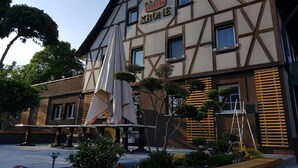 A traditional half-timbered building with a sign reading "Krone Hotel".