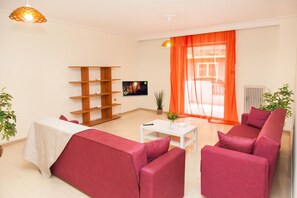 Apartment, 2 Bedrooms | Living room | Flat-screen TV