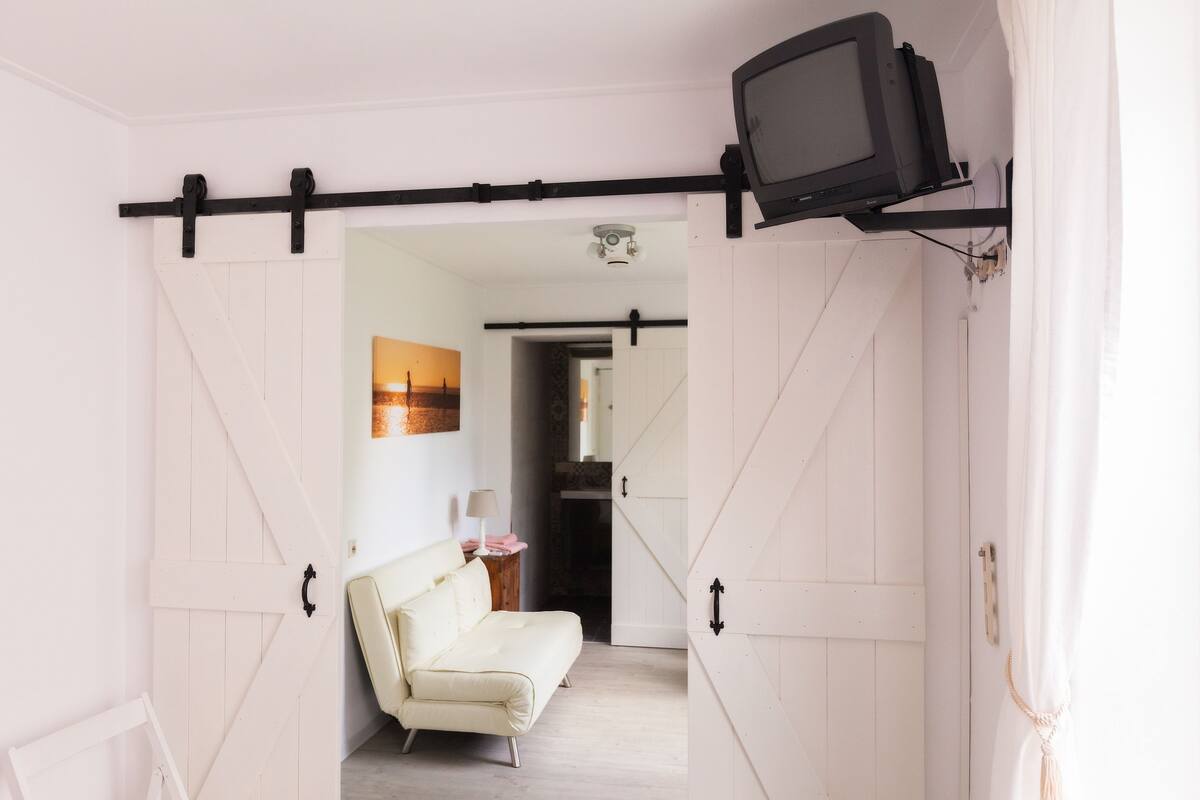 Superior Double Room, Garden View | Living area | Flat-screen TV