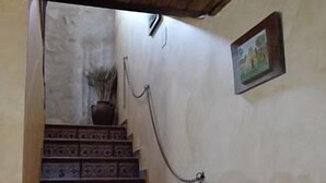 A wooden staircase with patterned steps leading upwards.