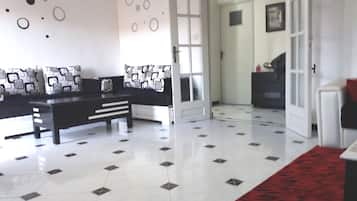 Family Apartment, 2 Bedrooms | Living area | 32-inch Smart TV with satellite channels, TV