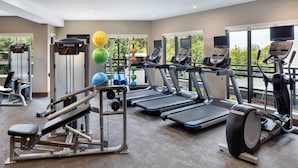 A gym with treadmills, elliptical machines, and free weights. - Residence Inn by Marriott Seattle South/Renton (Renton)