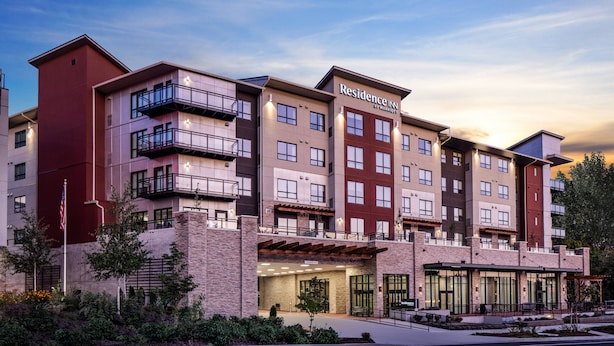A multi-story hotel with a modern design, featuring balconies, large windows, and a prominent entrance. - Residence Inn by Marriott Seattle South/Renton (Renton)