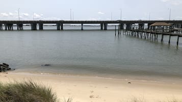 On the beach, sun-loungers