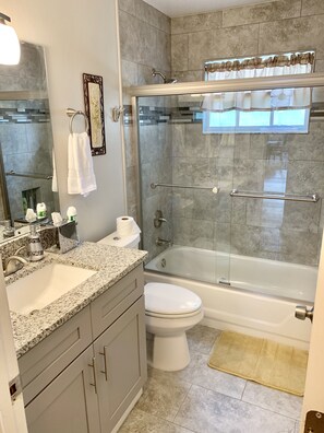 Bathtub, hair dryer, towels, soap